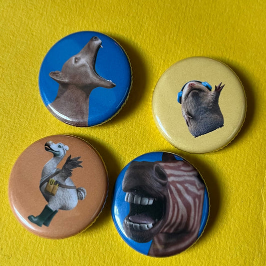 Four animal-themed button badges (32mm)
