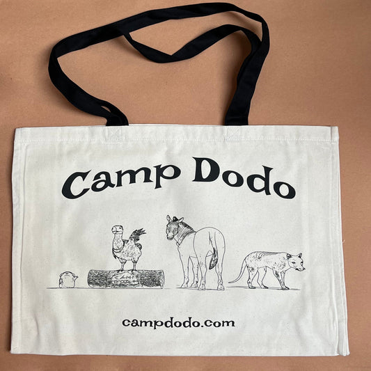 Large, canvas tote bag with 'Camp Dodo' text and illustrations on a beige background